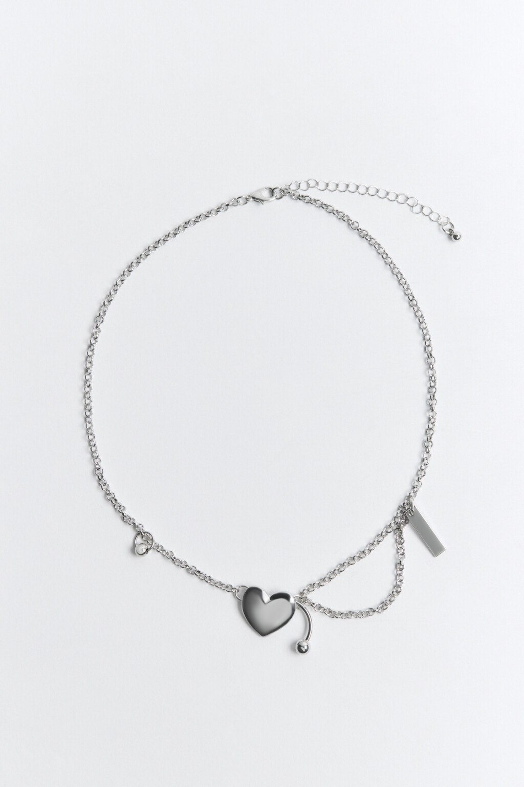 Цепочка серебристая с сердечком и пирсингом - цвет серый - 1